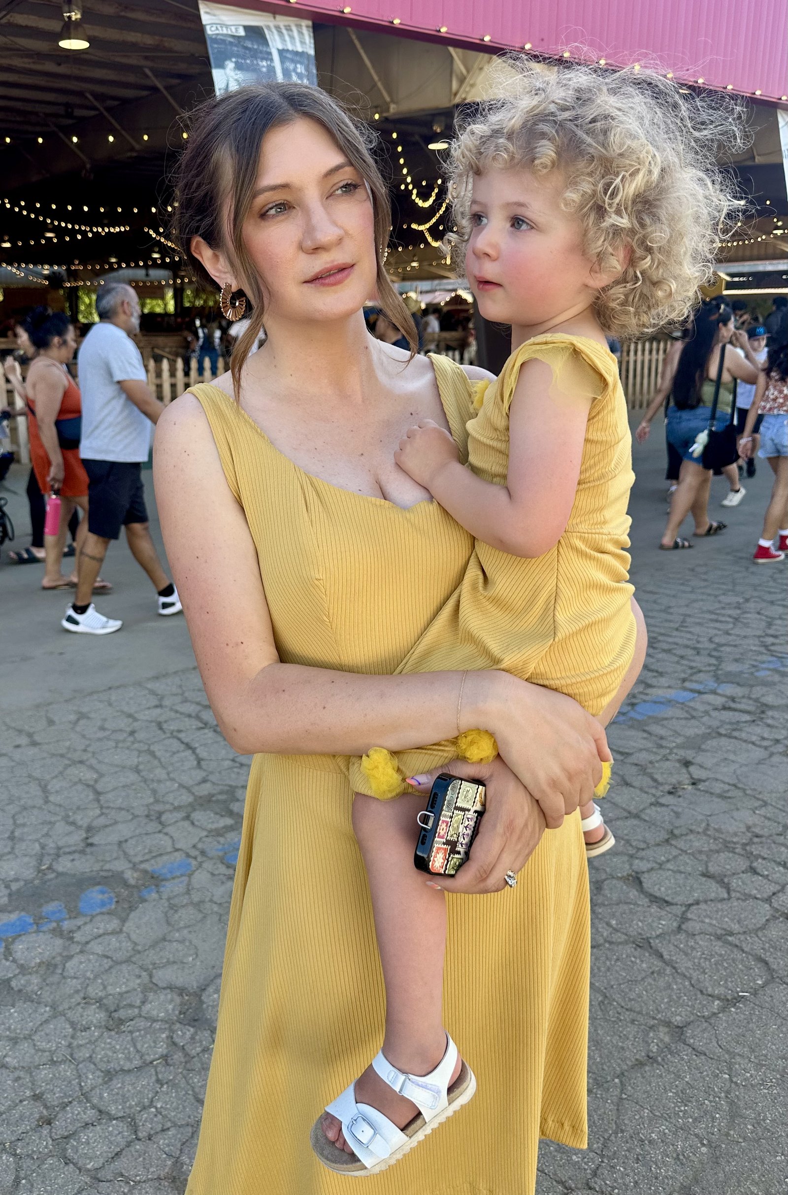 Custom yellow special-occasion dress, worn at golden hour